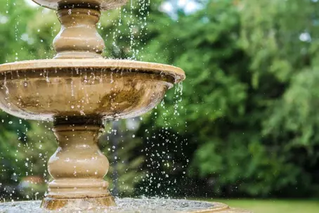 Beautiful vintage water fountain in a garden
